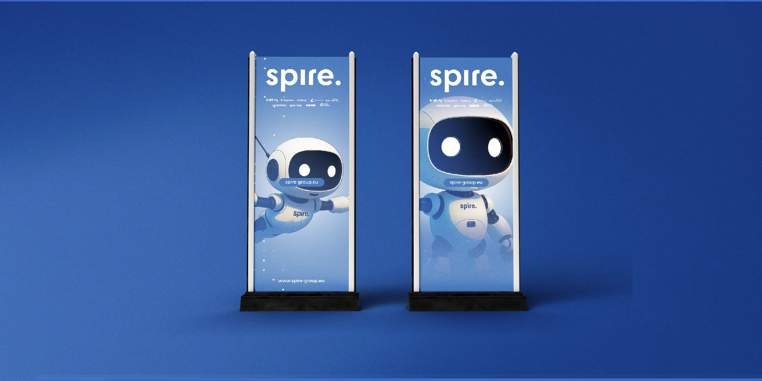 Mockup of two Spire branded rollup banners positioned against a bright blue background.