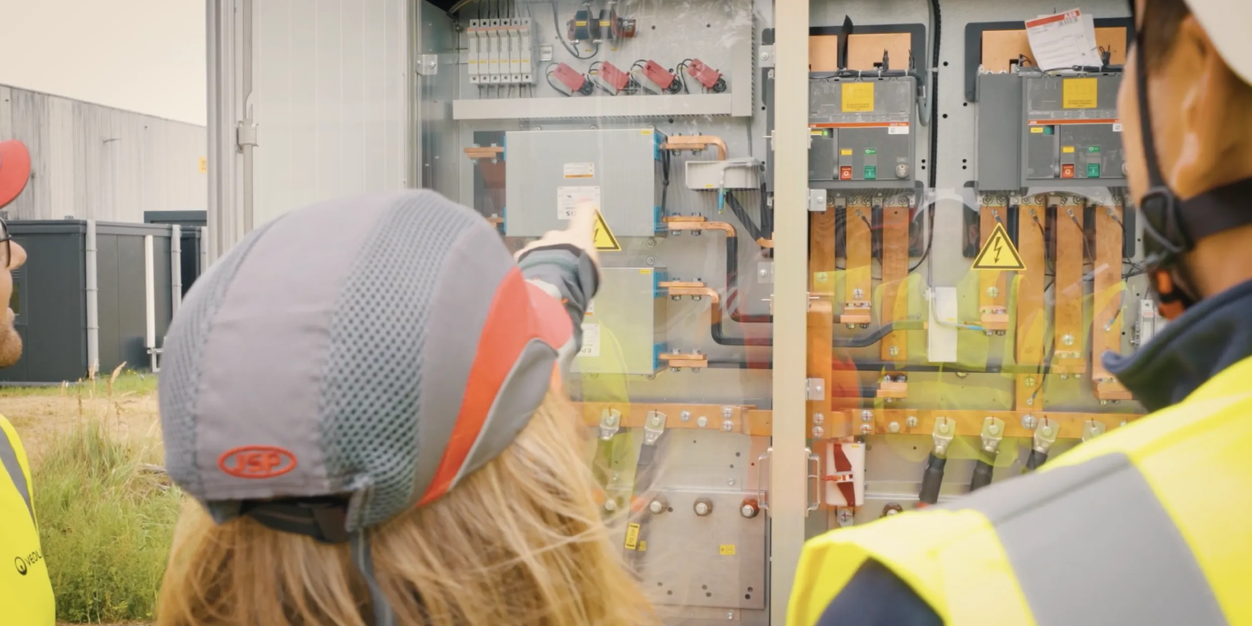 Still shot of the Coretecs Veolia casemovie of some people walking outside the building with some subs on top.