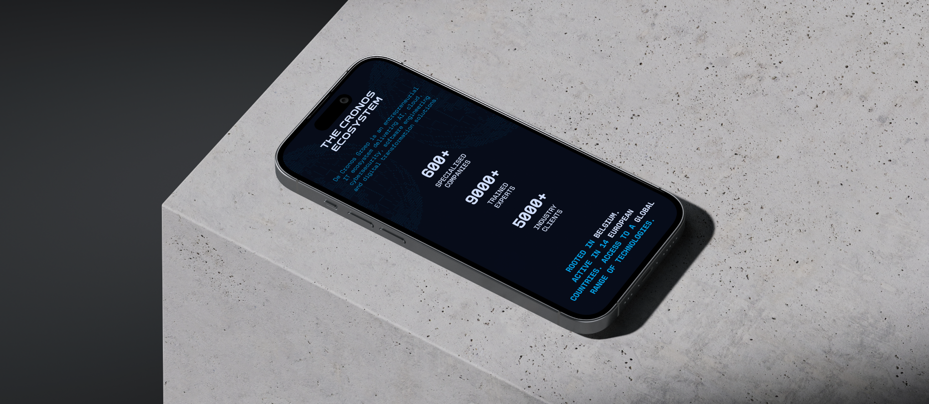 Smartphone displaying Cronos Defence ecosystem statistics on a dark screen, placed on a textured concrete surface.
