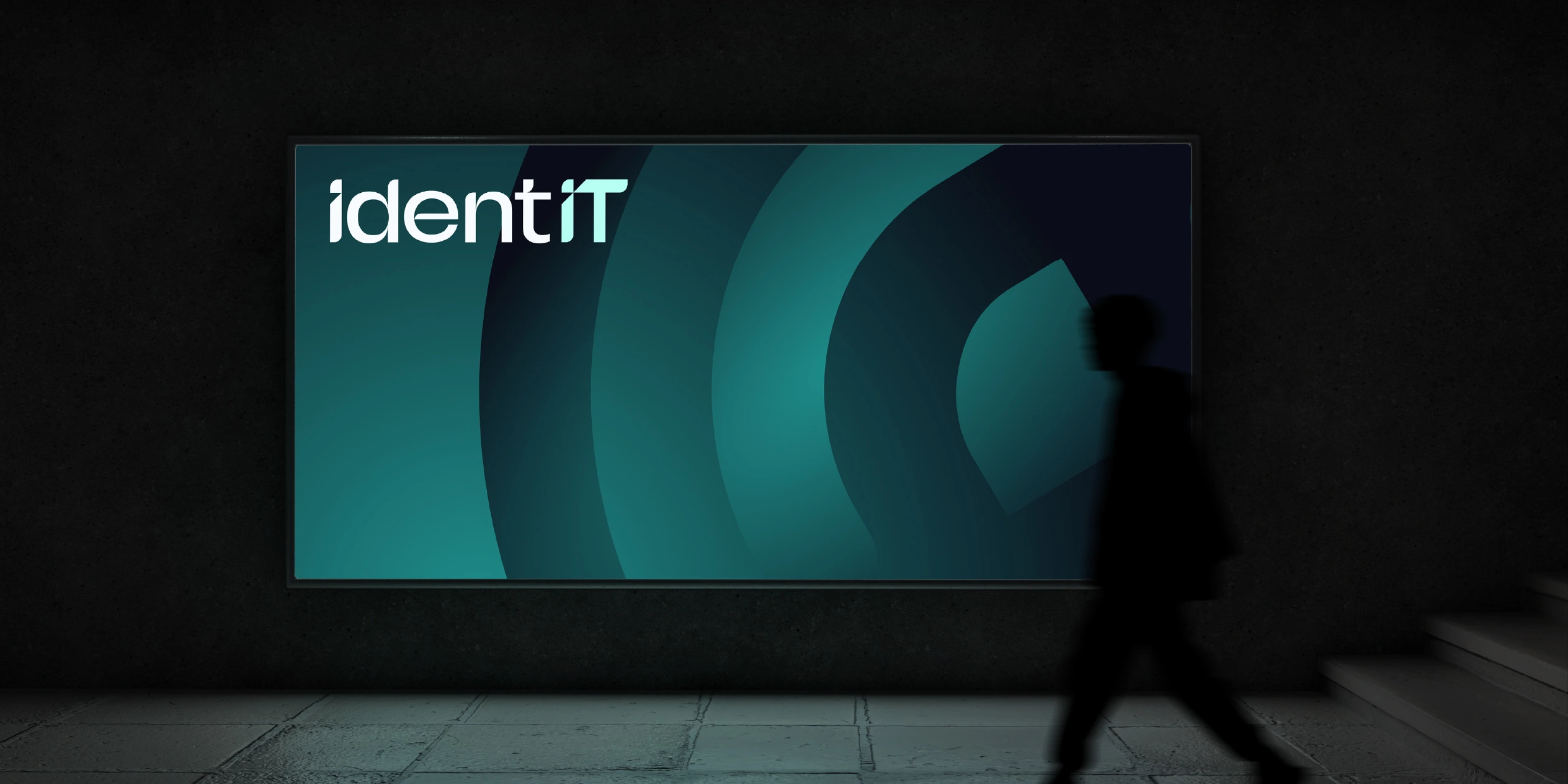 A render of IdentIT's branding on a large physical poster.