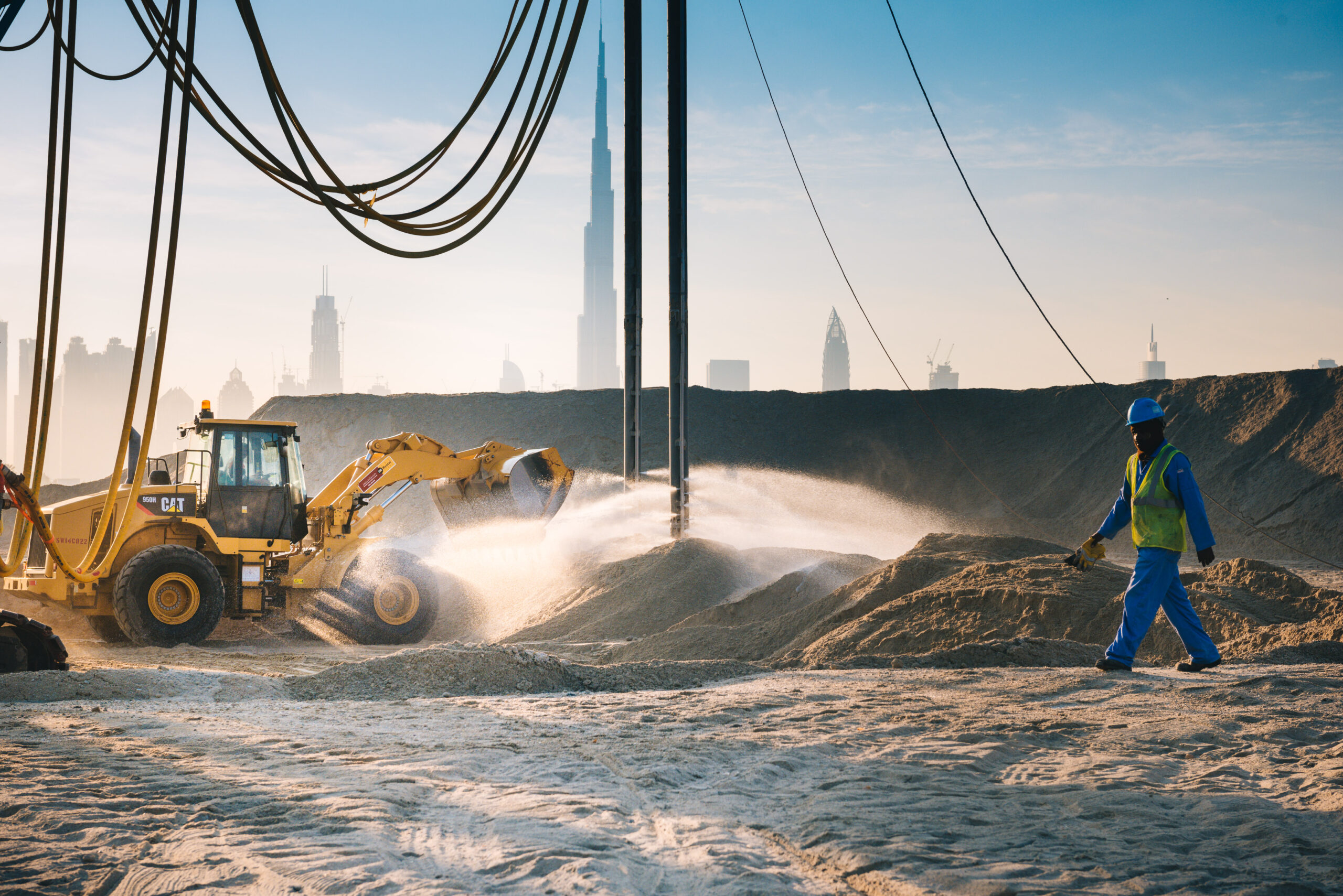 An uneven interlock driveway with visible ruts and water pooling, demonstrating the consequences of poor site preparation services.