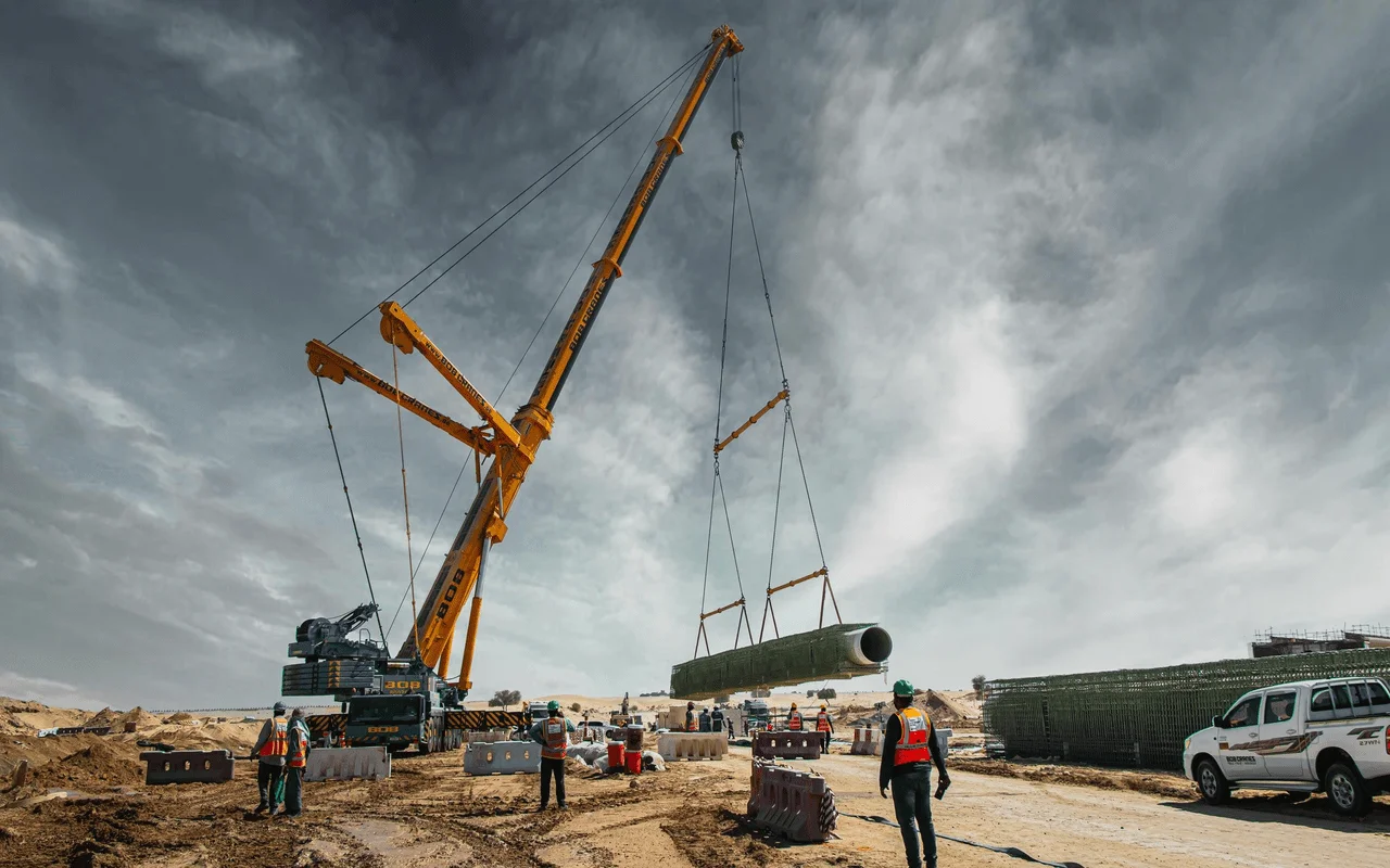 A heavy lifting service team securing a Jacuzzi with industrial slings before lifting it with a crane.