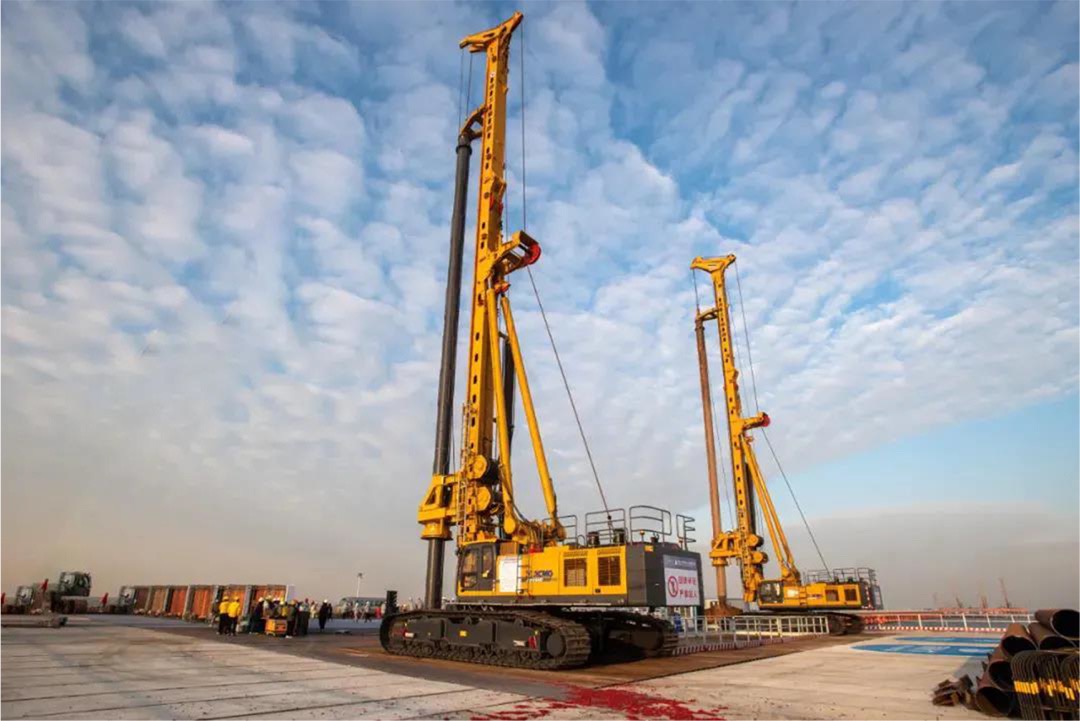 A technician performing a Plate Load Test on a compacted site surface to verify ground bearing capacity before the arrival of piling machine hire equipment.