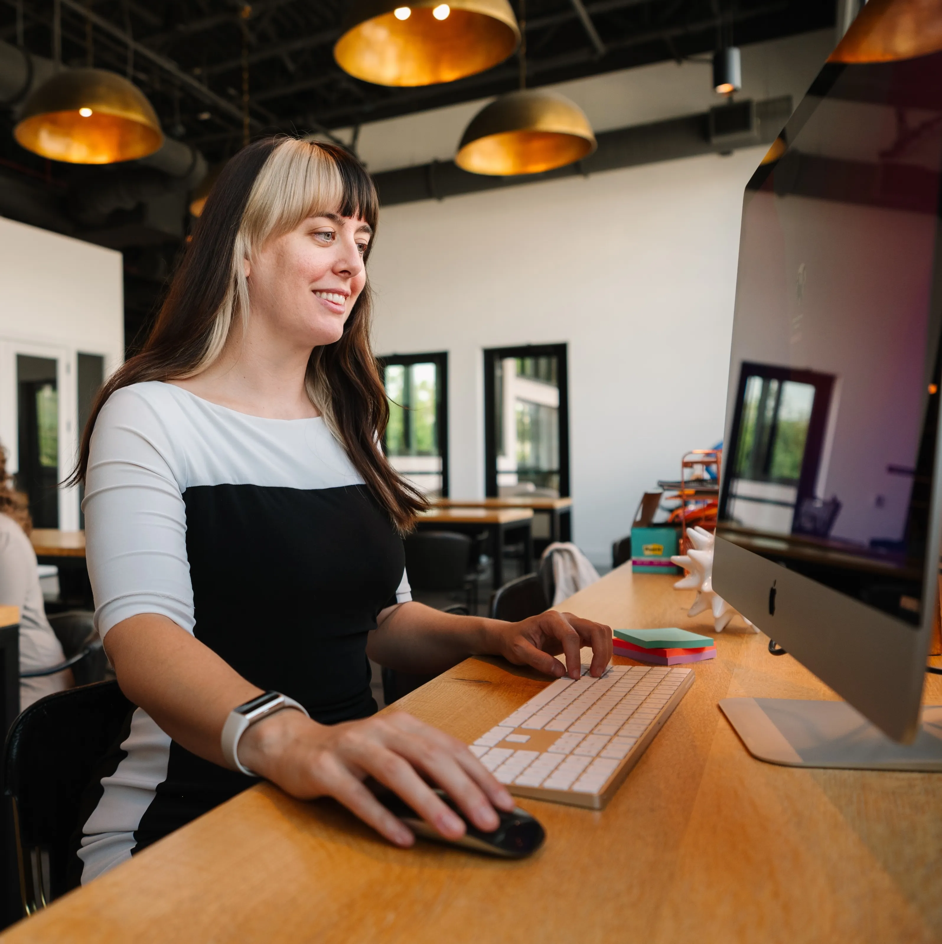 Stephanie, Brand and Graphic Designer at Barrena Branding & Marketing, working in the studio