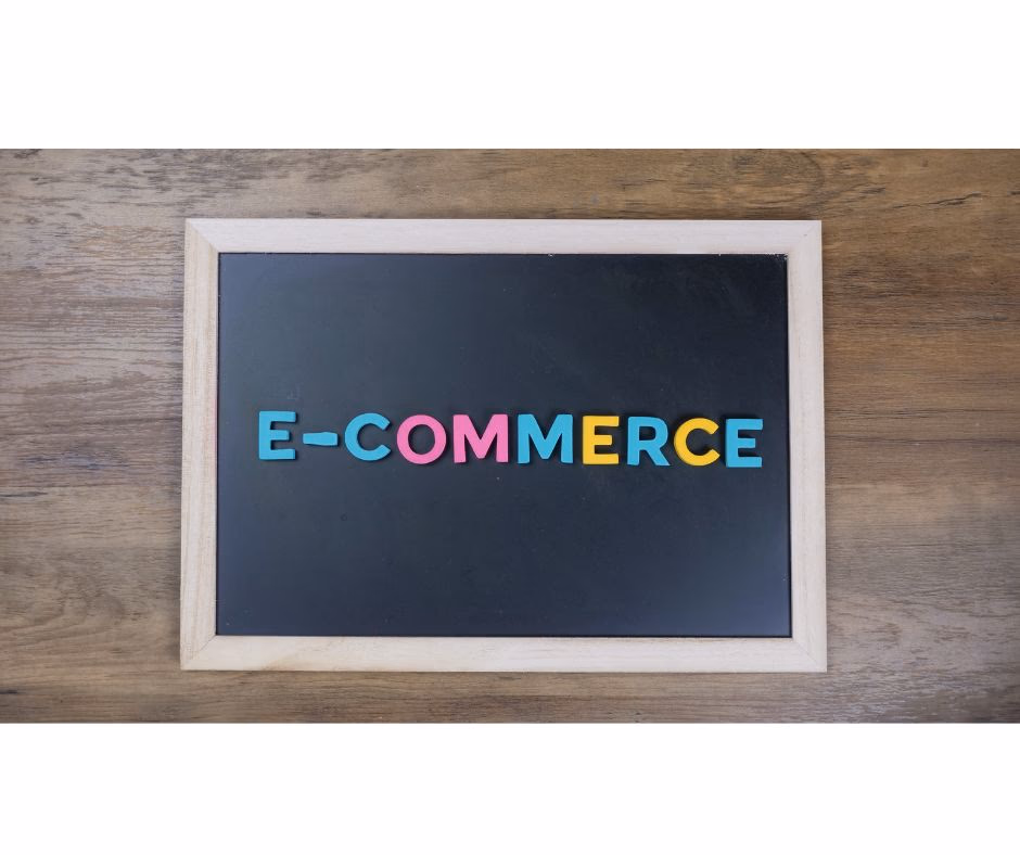 Board with a black background with the word e-commerce written in several colors.