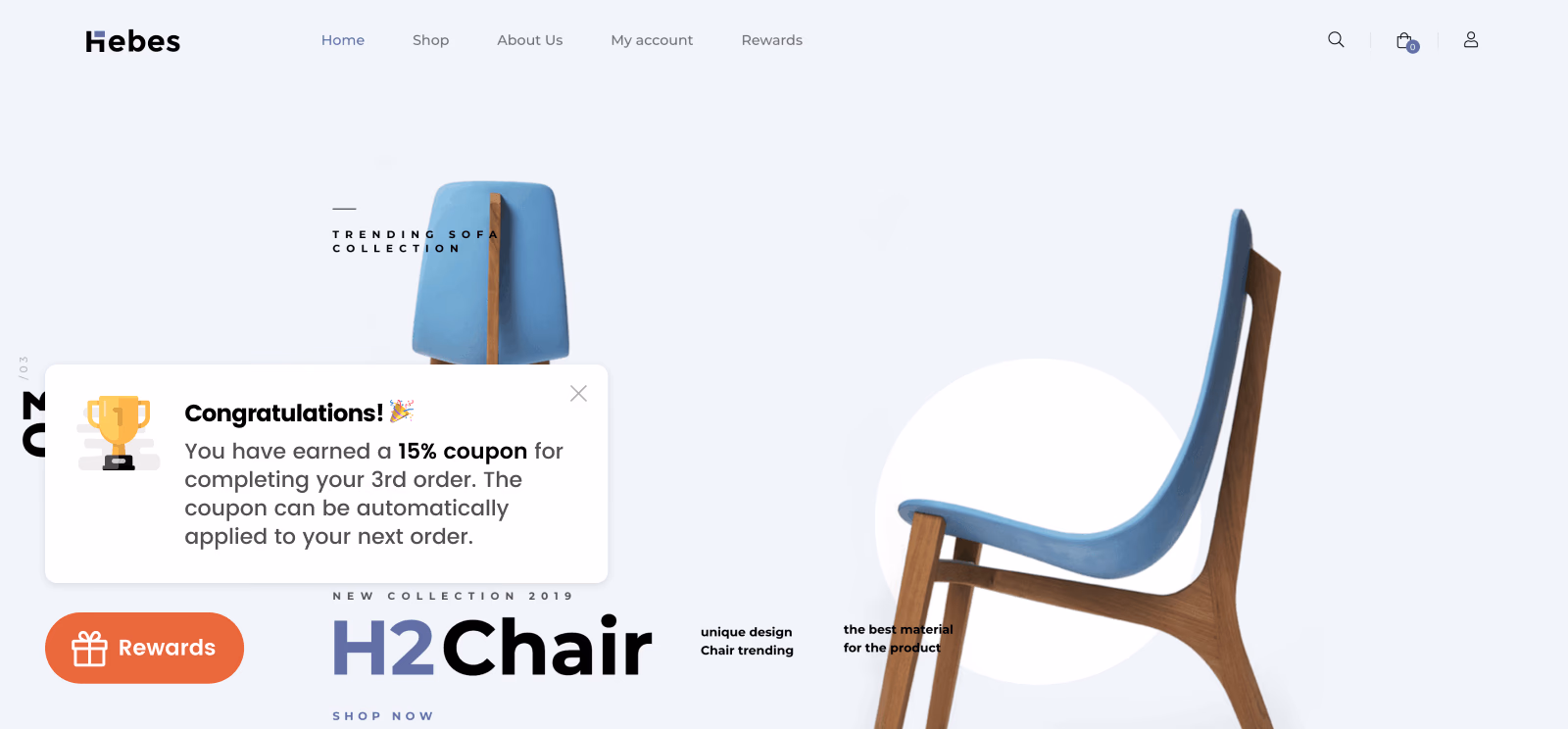 Homepage for Hebes, featuring chairs. A rewards popup congratulates a user with a 15% off coupon.