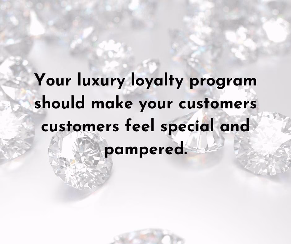 Diamonds scattered on a white surface with text about a luxury loyalty program.