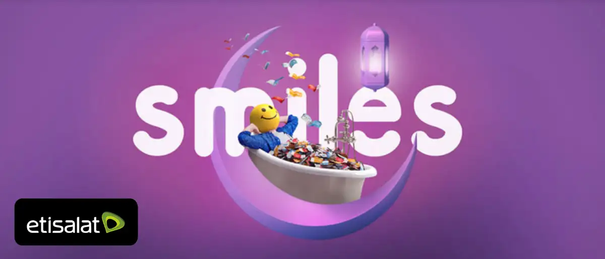 "Smiles" text with smiley face in a tub of coins set in a crescent, an Etisalat ad.