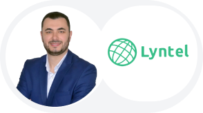 Headshot of a smiling man in a suit with the Lyntel logo.
