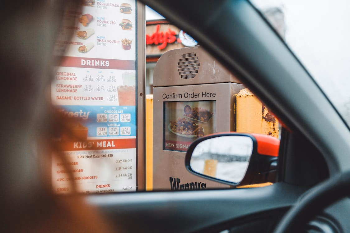 Ordering at the Wendy's drive-through; view of the menu and confirm order screen from inside the car.