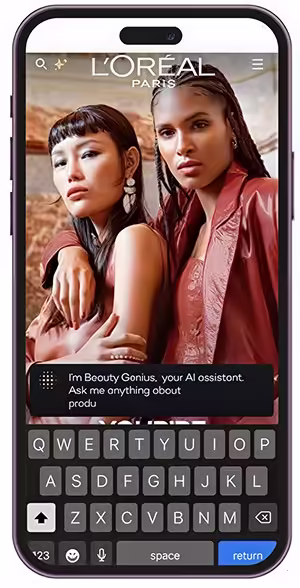 Phone displaying L'Oréal Paris' Beauty Genius AI chatbot with two models in the background.
