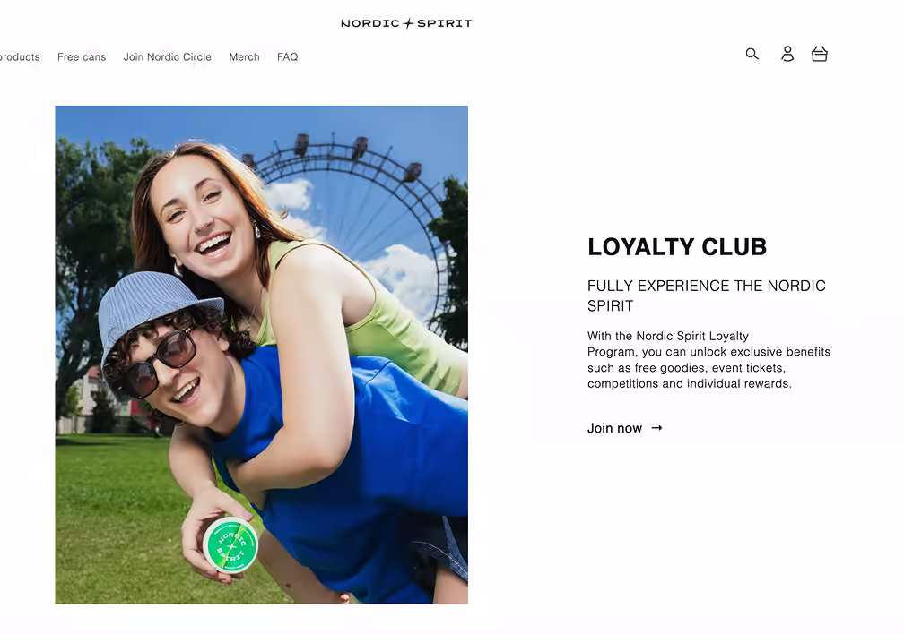 Couple smiles, piggyback ride with Nordic Spirit product, theme park background.