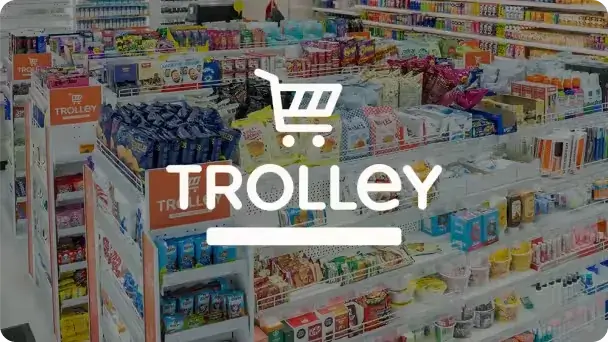 Supermarket shelves packed with products; overlaid with "Trolley" graphic.