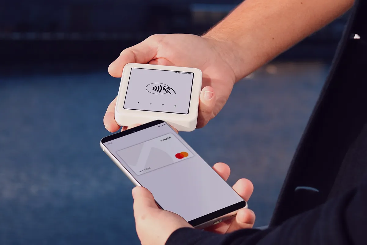 Close-up photo of a contactless payment with a smartphone on a Sumup POS terminal.