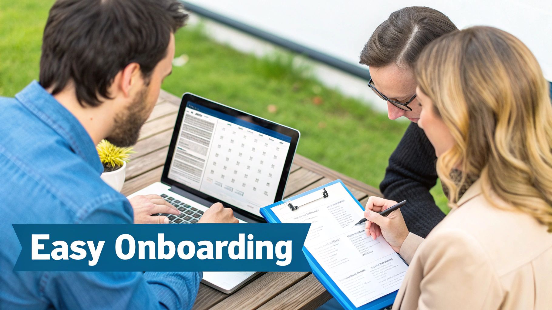 Three people collaborate outdoors: a man on a laptop, a woman writing on a clipboard, signifying easy onboarding.