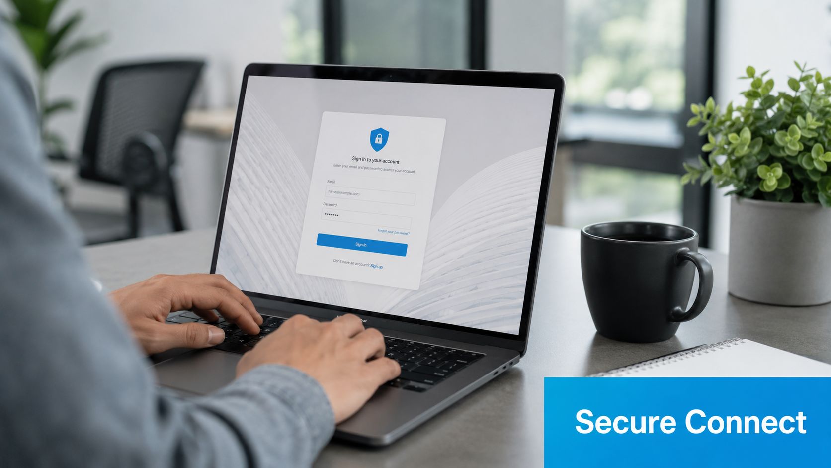 A person typing on a laptop displaying a secure login screen in a modern office environment.