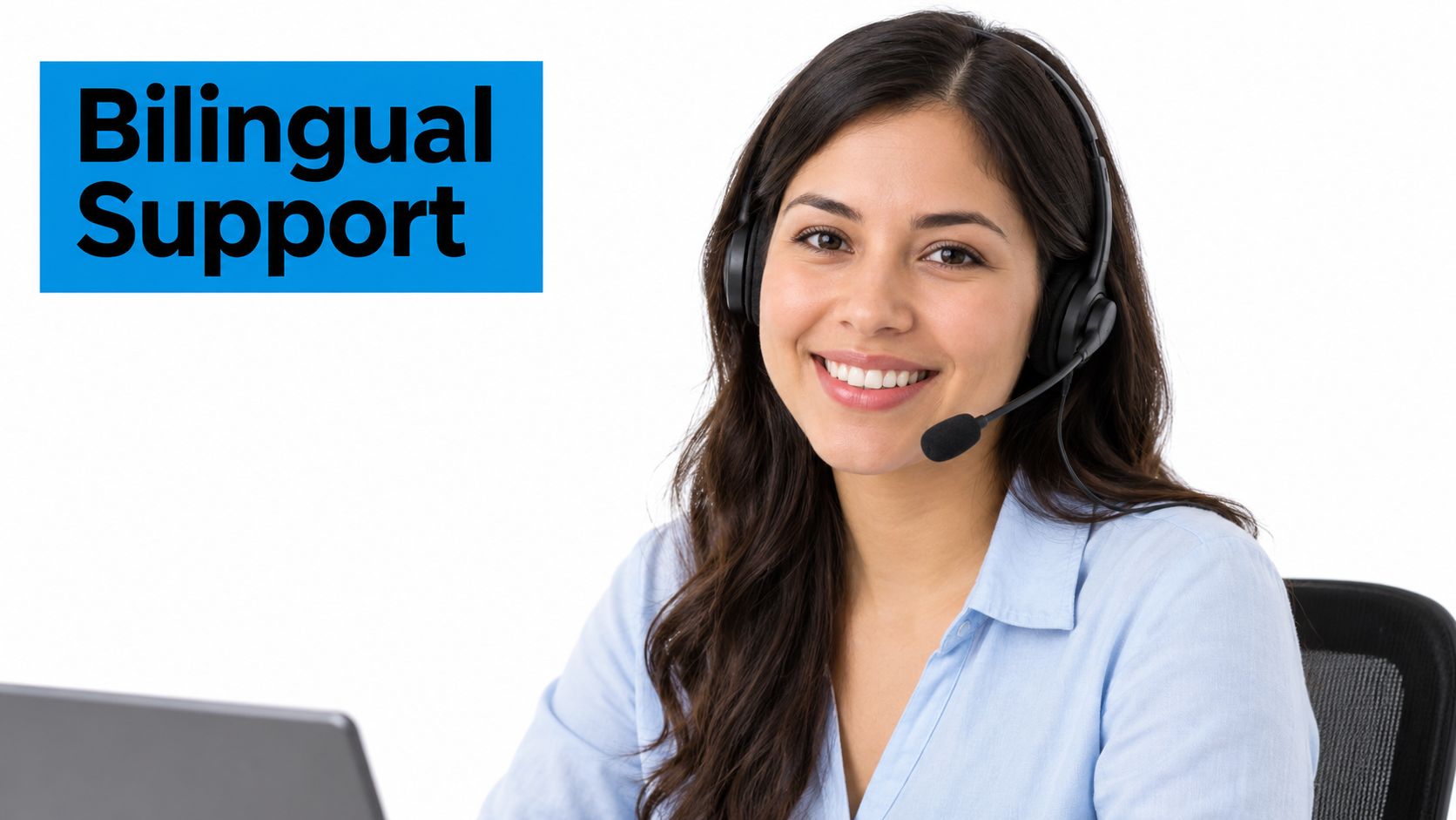 A friendly customer service representative wearing a headset and smiling while working at her laptop computer.