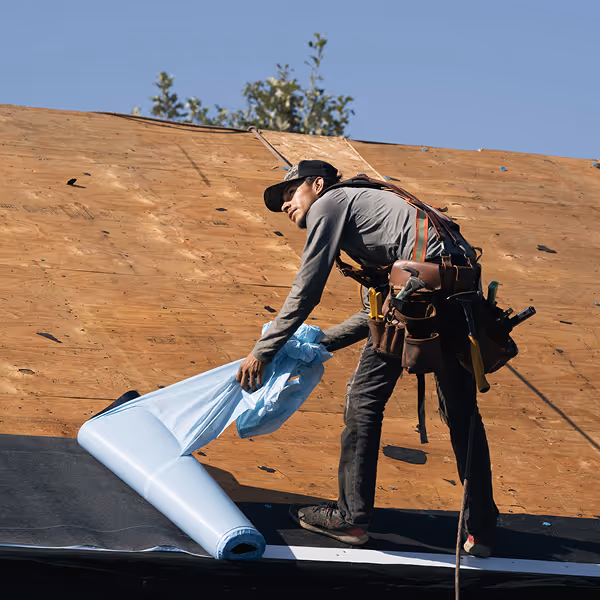 roofing crew safely installing waterproof roof underlayment roofing crew safely installing waterproof roof underlayment