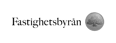 Fastighetsbyrån logotyp med text och en rund silvermedalj med ett träd.