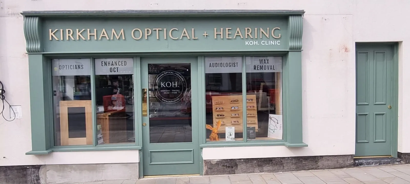 Kirkham Optical and Hearing clinic storefront with glasses display