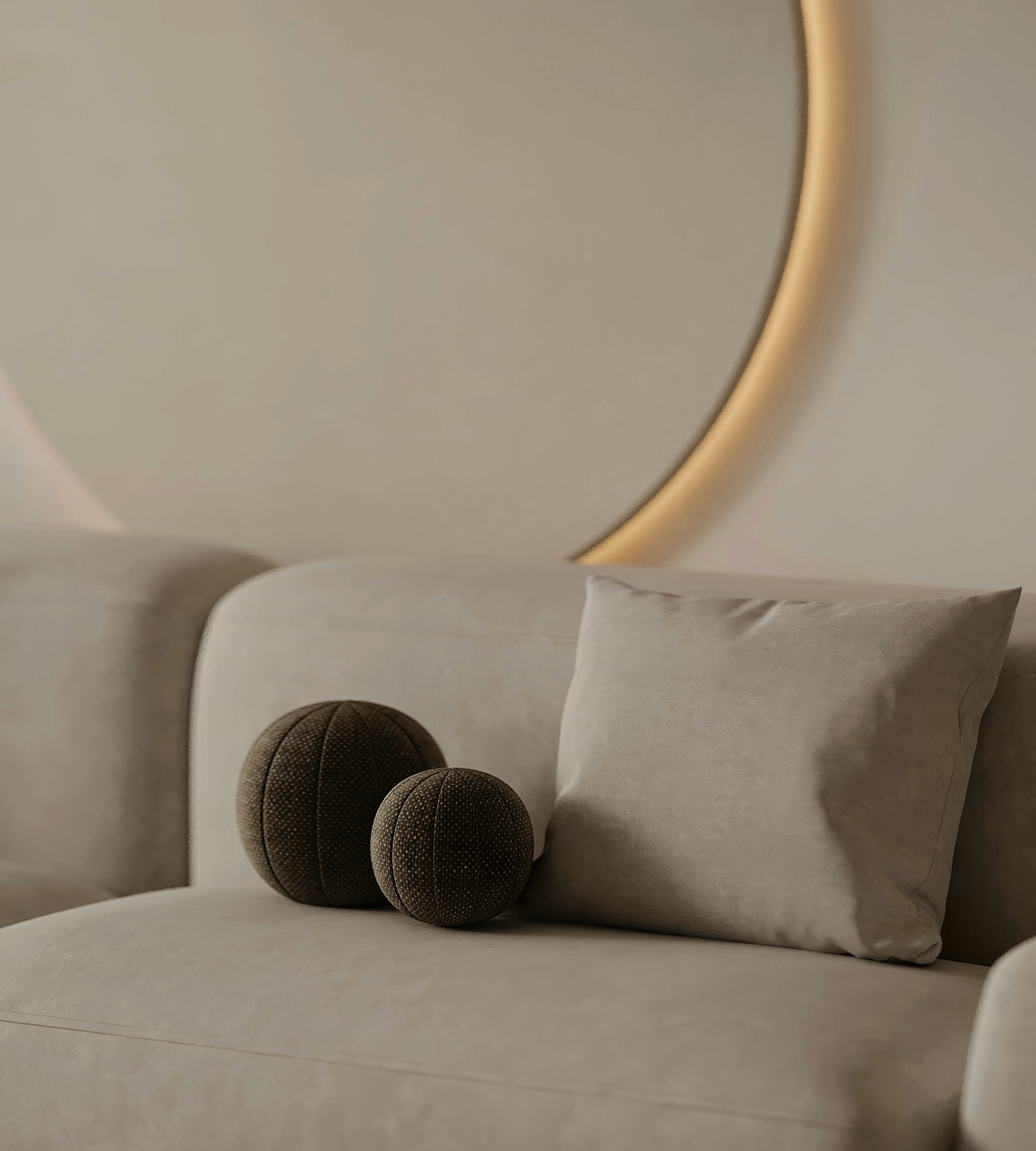A light-colored sofa in the interior, spherical soft pillows, a backlit mirror in the background