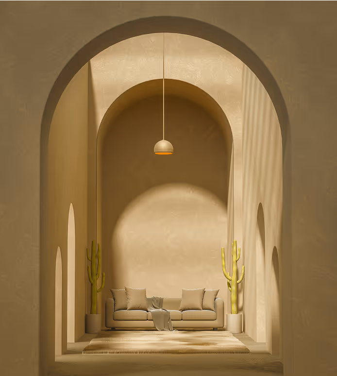 Minimalist beige seating area with sofa, two potted cacti, rug, and hanging pendant light in arched room.