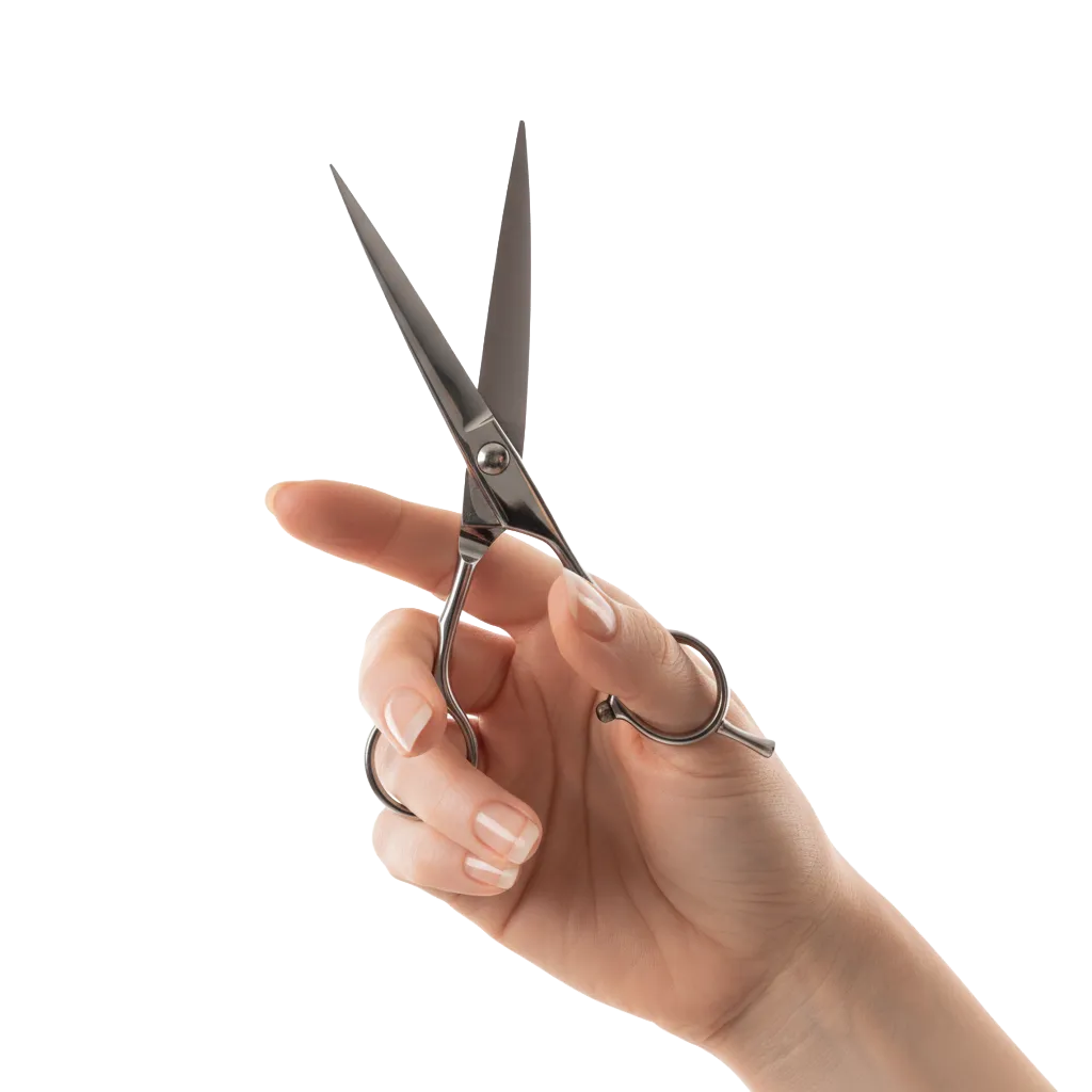 Open silver haircutting scissors held in a stylist’s hand