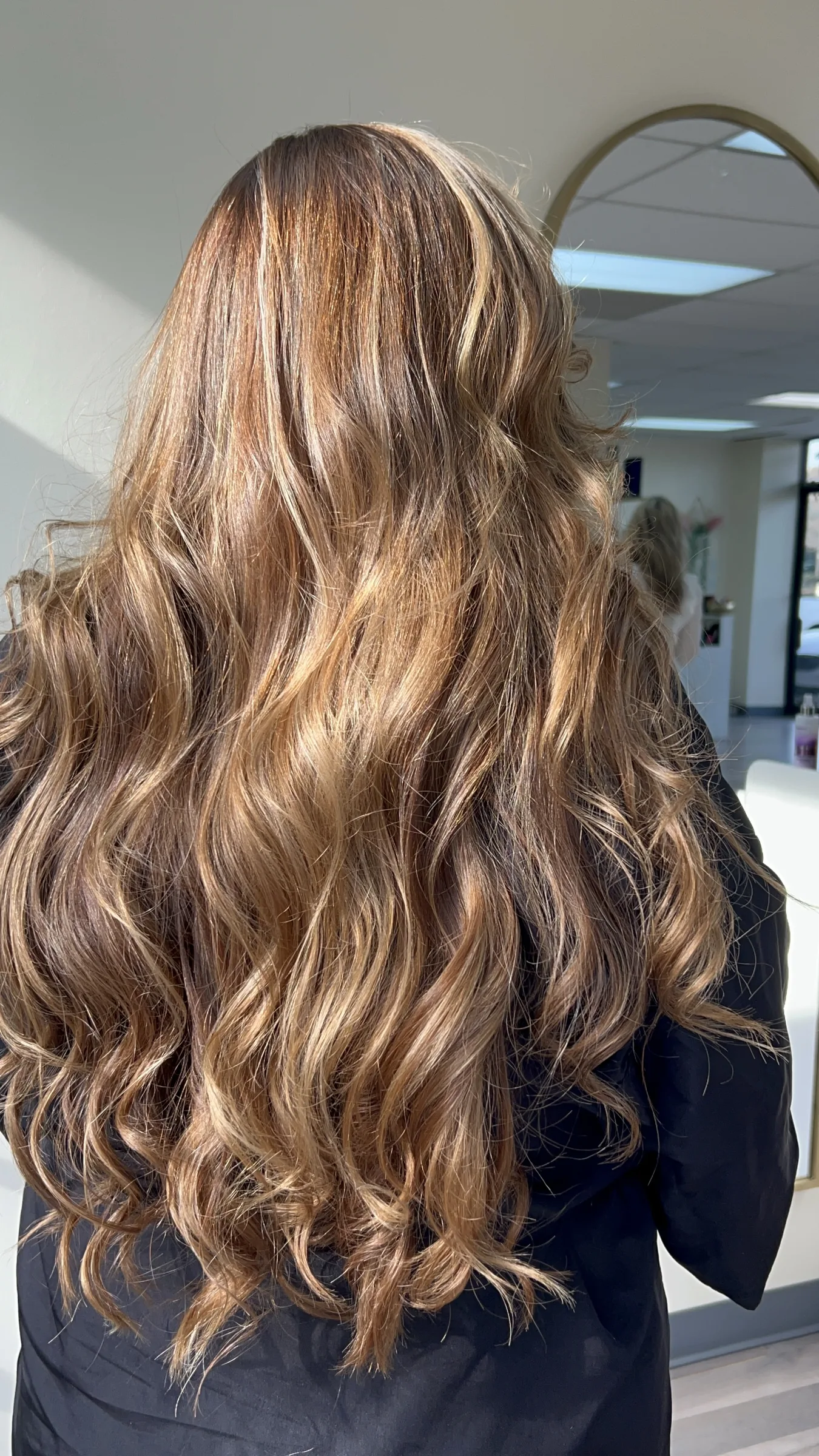 Long wavy hair with dimensional blonde highlights