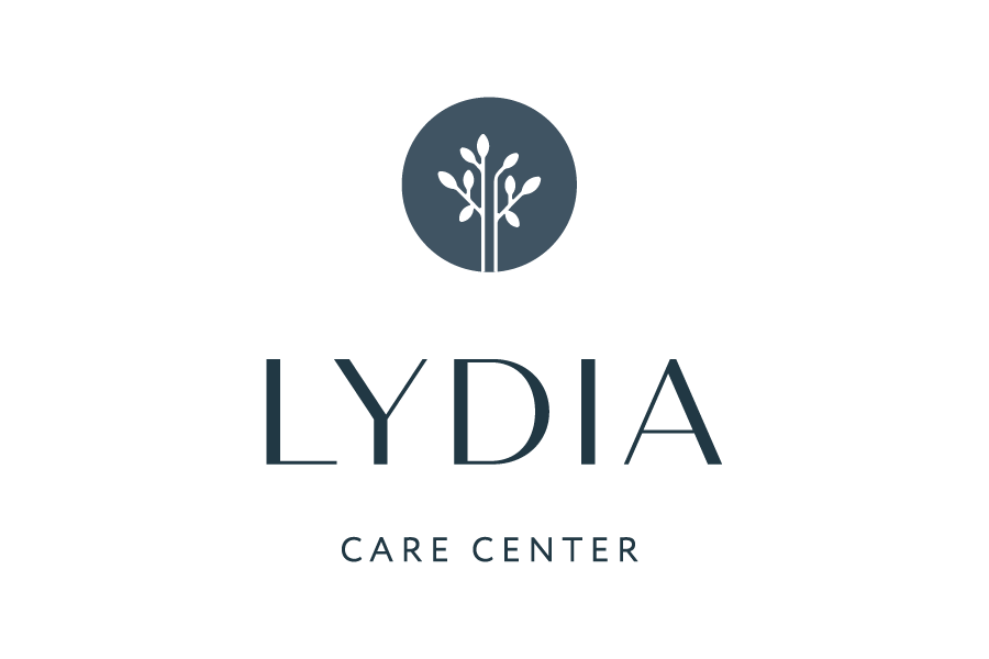Logo with a stylized tree in a circle above the text 'LYDIA CARE CENTER'.