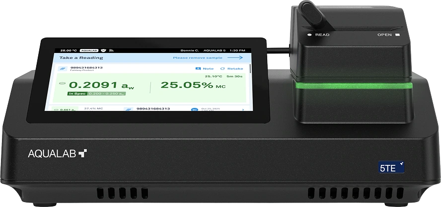 AQUALAB 5TE moisture analyzer with a digital touchscreen displaying sample reading results including aw value 0.2091 and moisture content 25.05%.