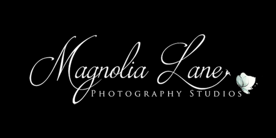 white Magnolia logo with black background