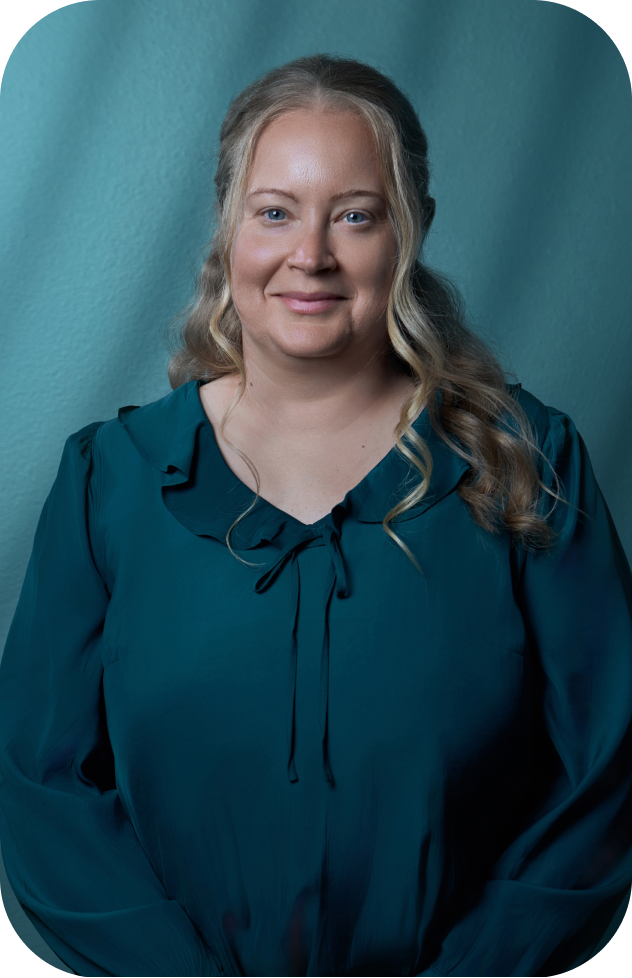 Jessica Pelkey, Bookkeeper, standing for a professional portrait