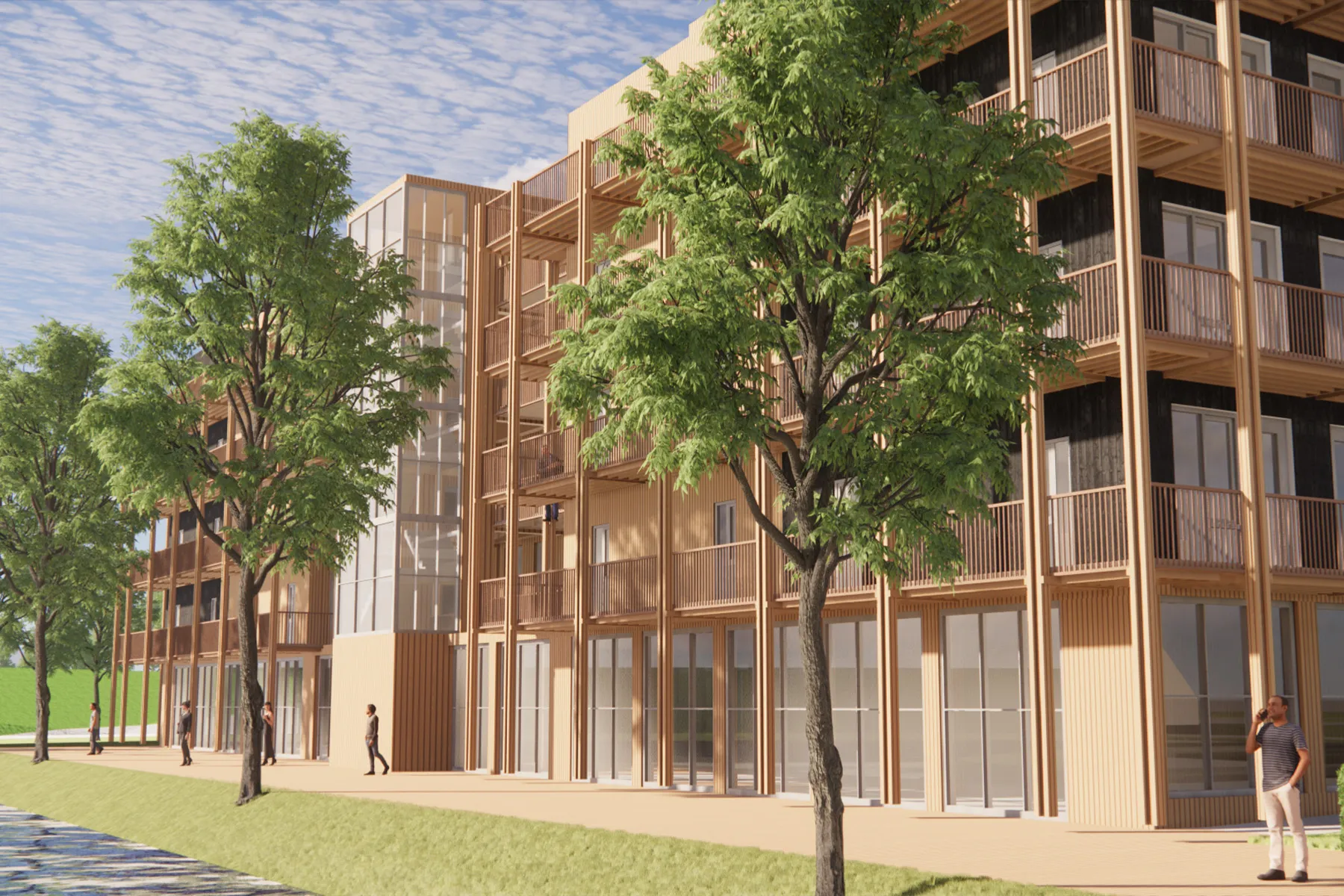 Modern woongebouw met balkons, grote ramen en bomen langs een voetpad.