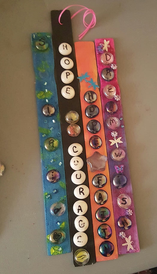 A vibrant bracelet adorned with colorful buttons and beads, showcasing a playful and artistic design.