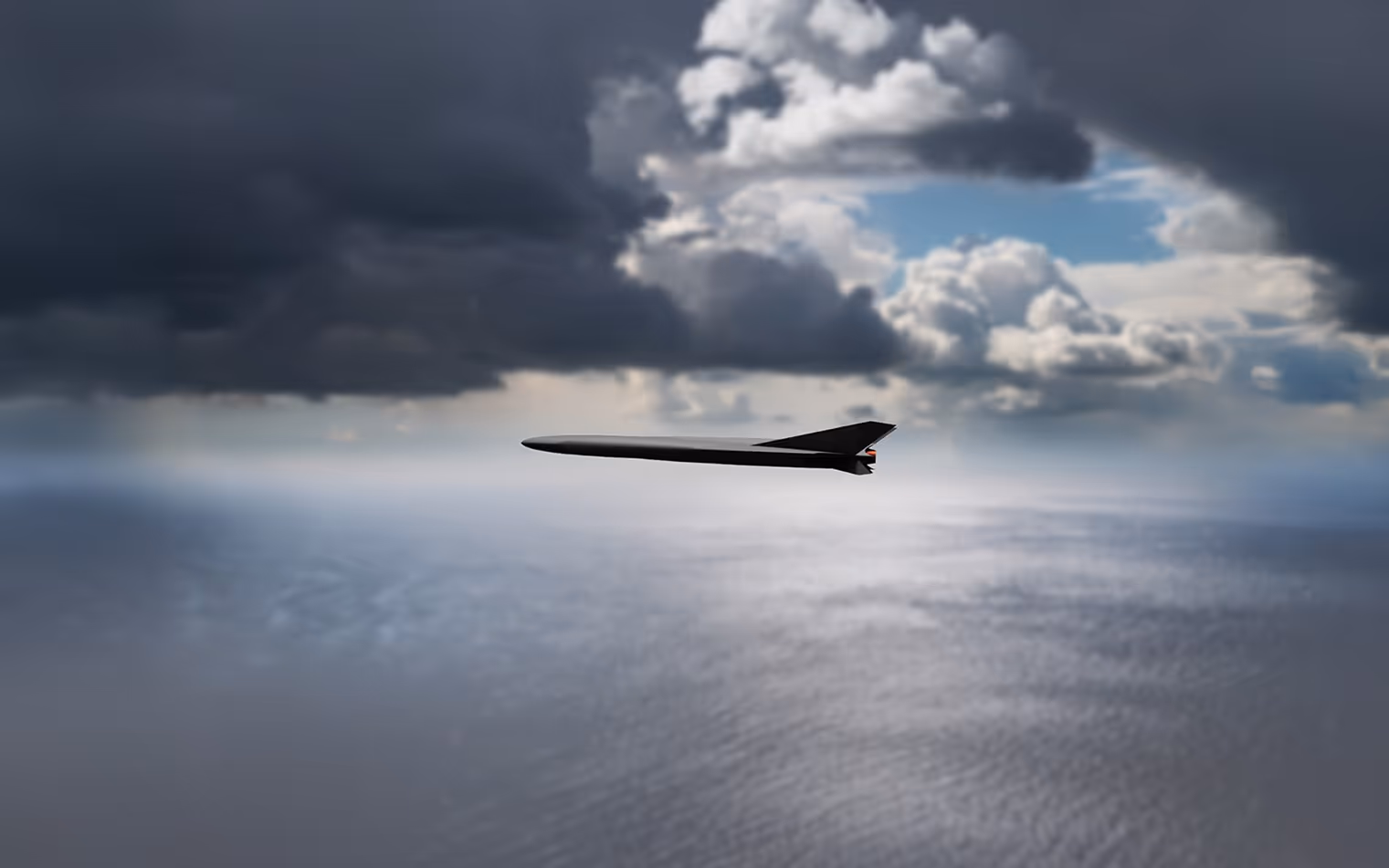 sleek black UAV flying above the ocean under a dramatic cloudy sky.