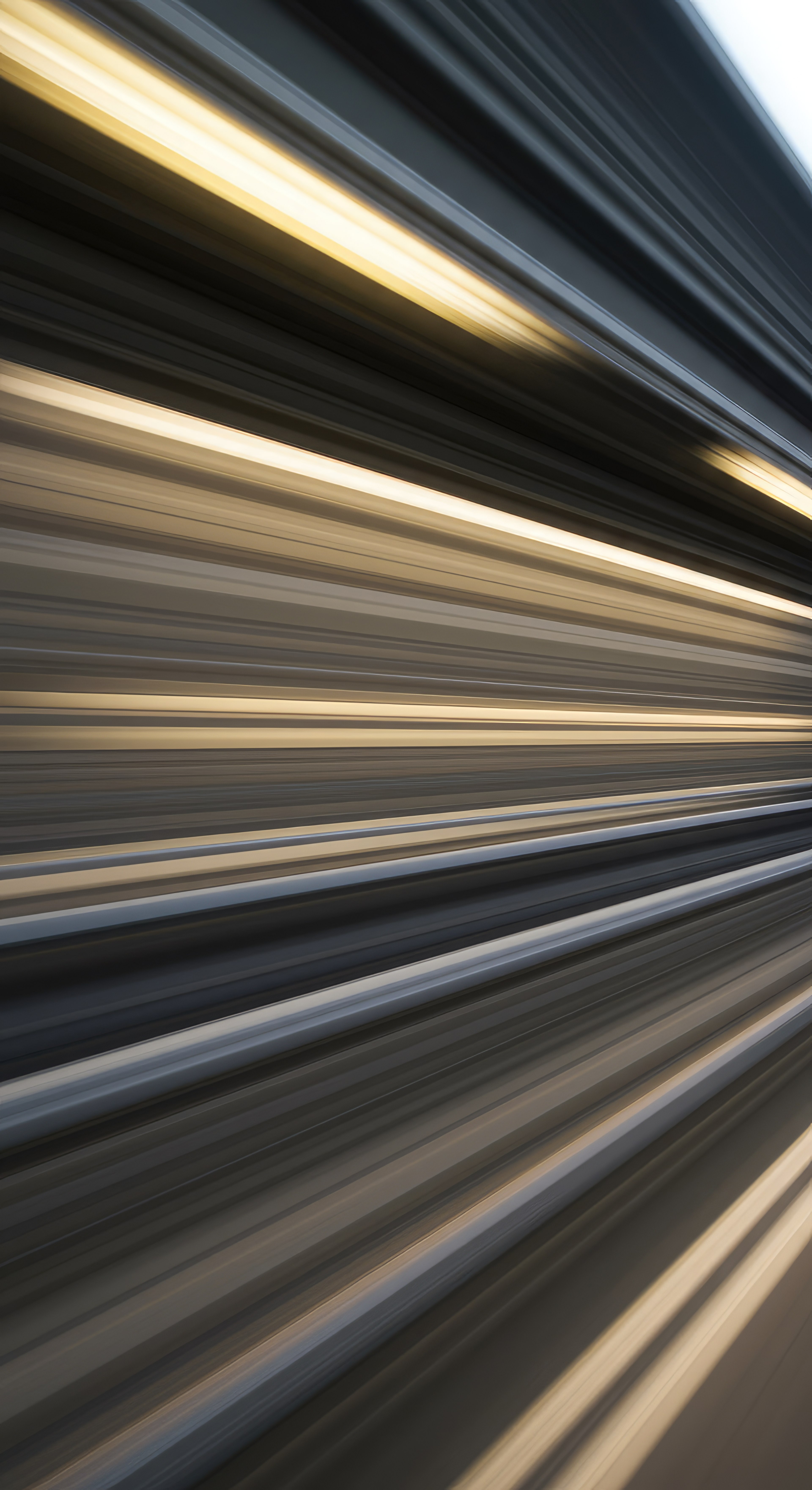 a long-exposure photograph showing car light trails, capturing the movement and speed of traffic at night