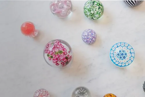 Someone smiling and holding ceramic bowl.