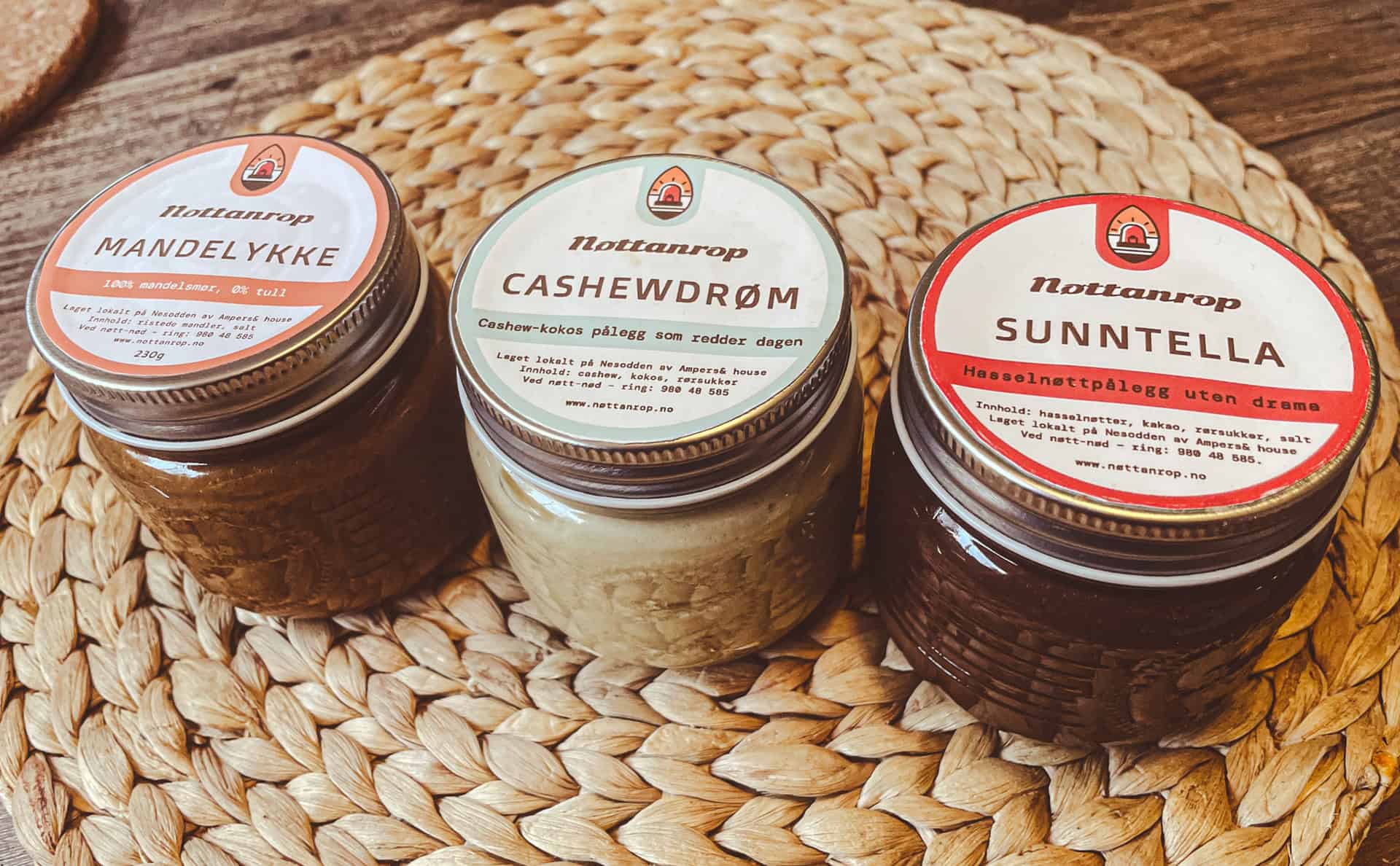 Burger with fried fries on black plate with sauce on the side