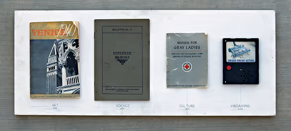 Four vintage publications displayed on a white board labeled Art, Science, Culture, and Vacuuming, with each item representing a different category.