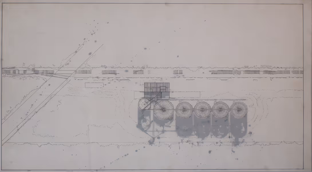 Architectural blueprint of a grain silo complex with six circular silos and adjoining rectangular structures.