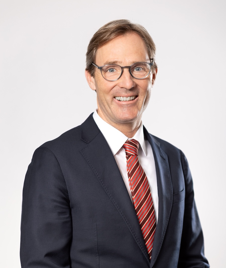 Stephan Meeder, CFO of AGRANA Beteiligungs-AG, smiling in a dark suit with striped tie [no AI]