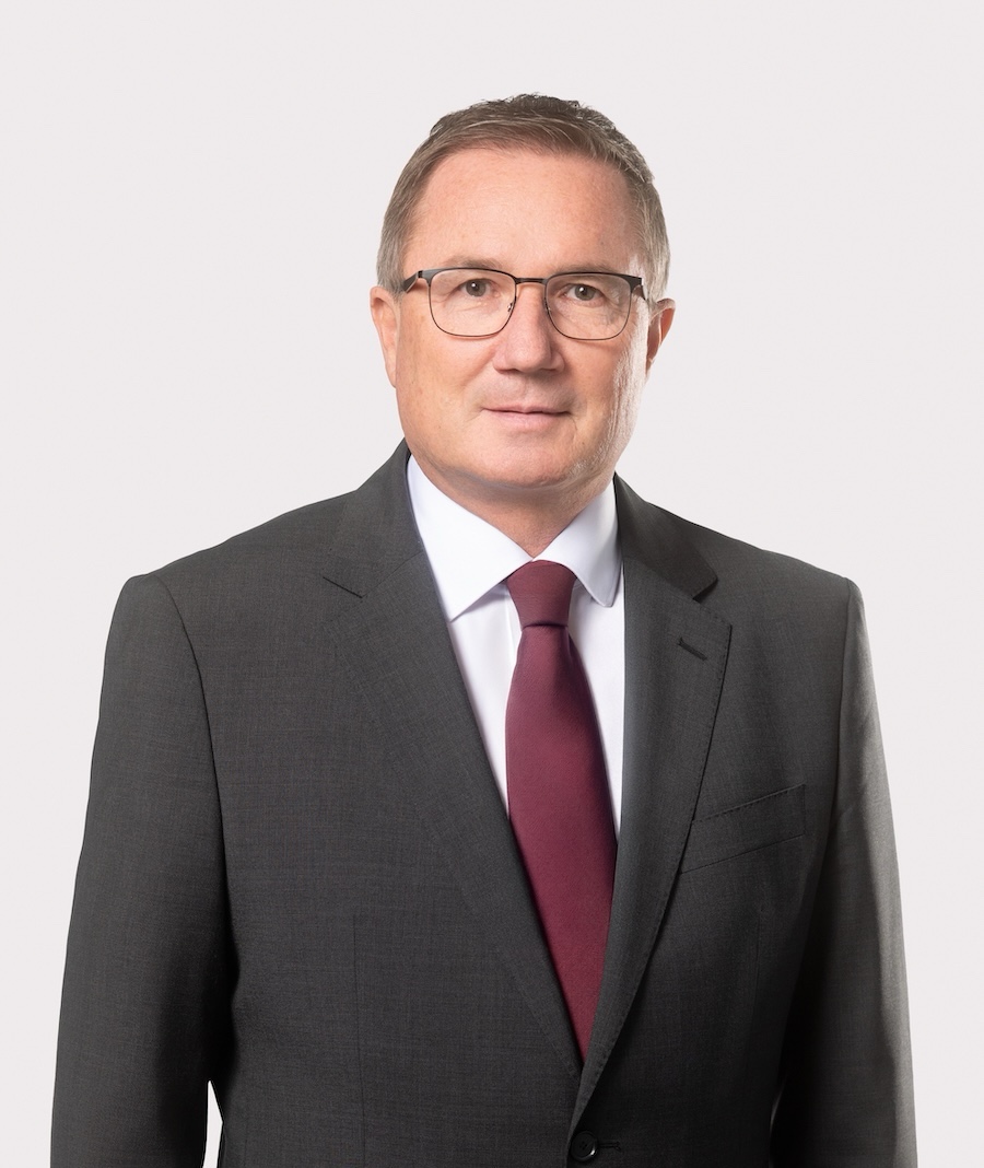 Franz Ennser, COO of AGRANA Beteiligungs-AG, in a grey suit with glasses and red tie [no AI]