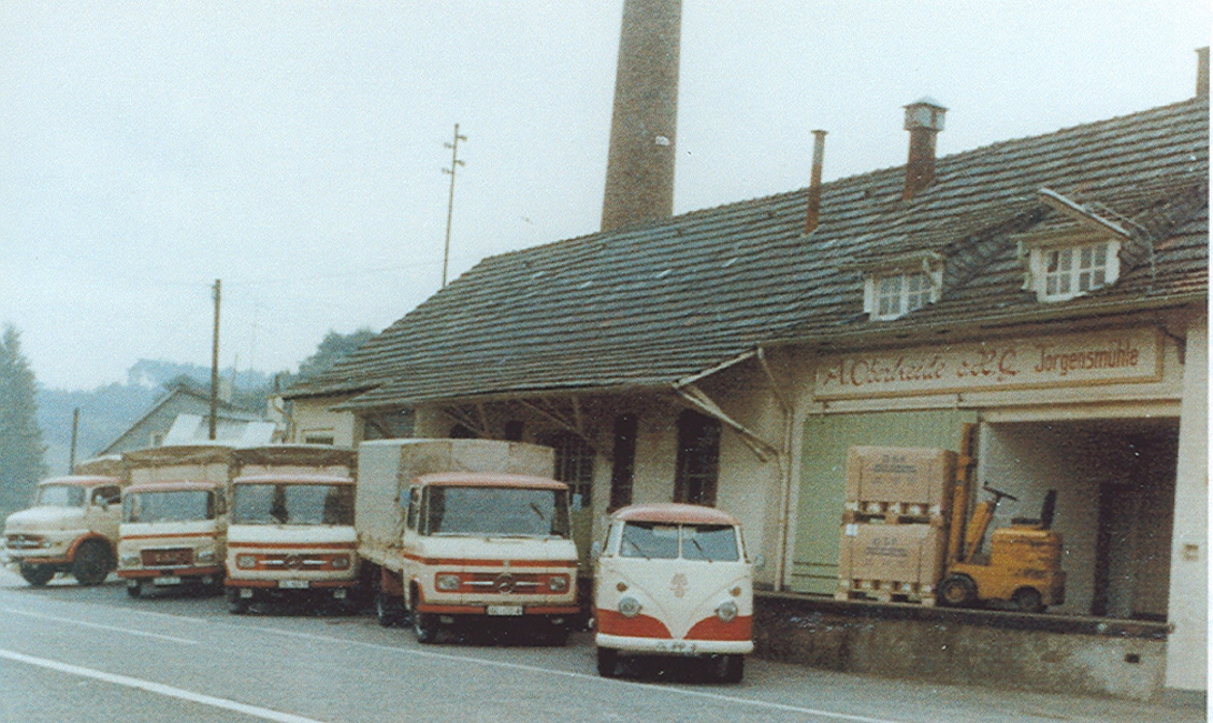 Historic photo of delivery vans and a forklift at the loading dock of the former plant in Germany [no AI]