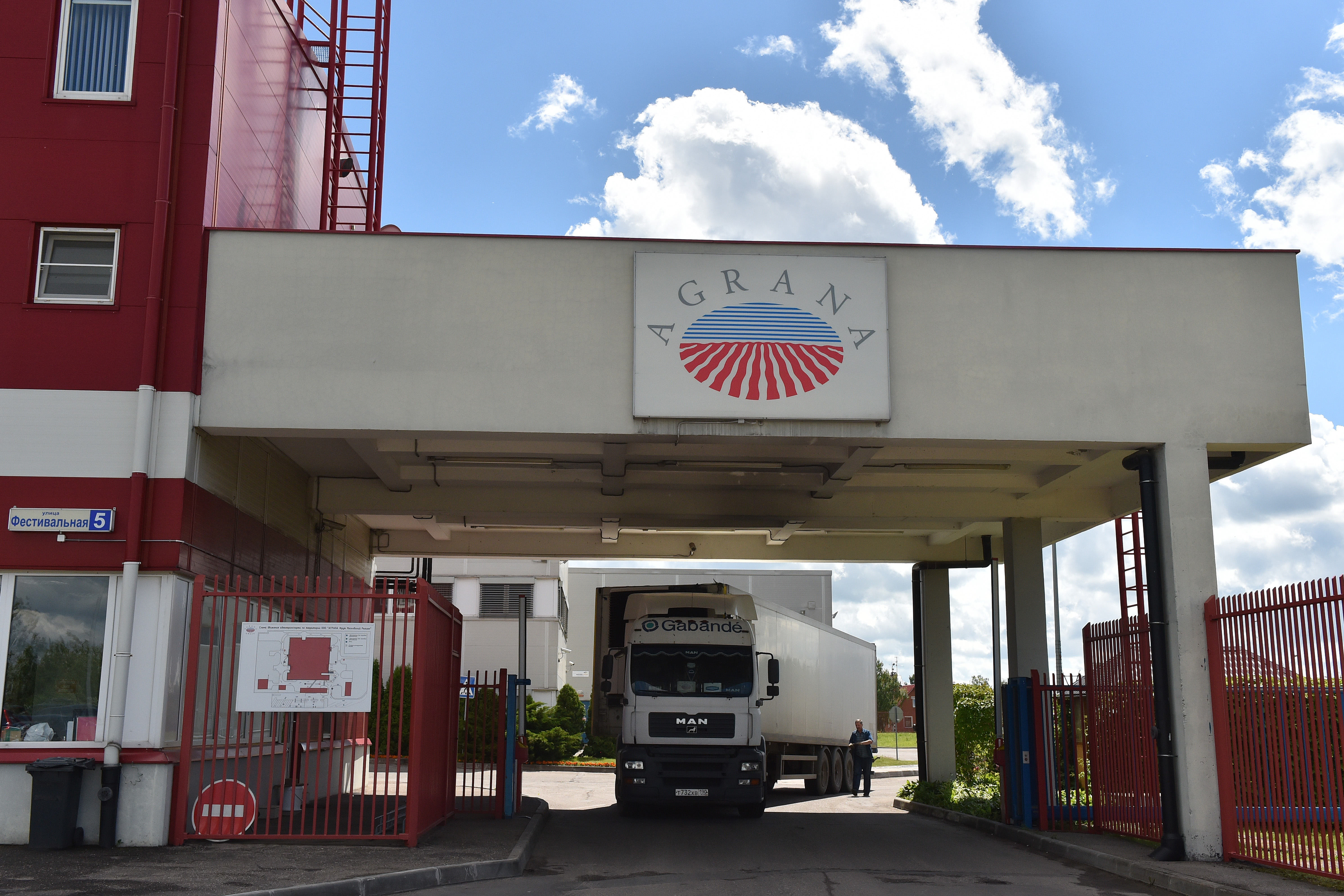 Entrance gate of the AGRANA Fruit plant in Serpukhov, Russia, with a truck passing under the AGRANA sign