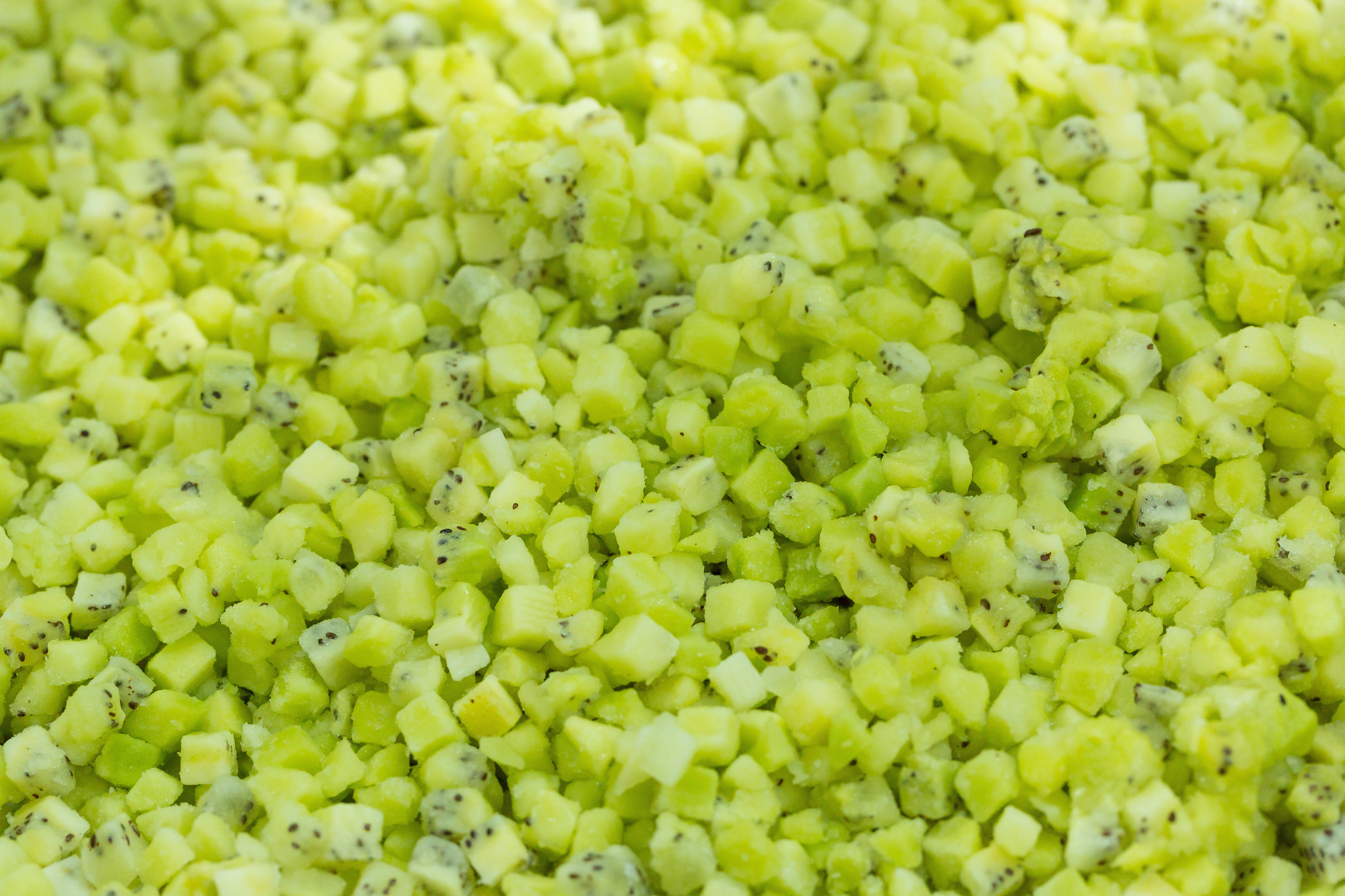 Close-up of diced kiwi pieces with black seeds