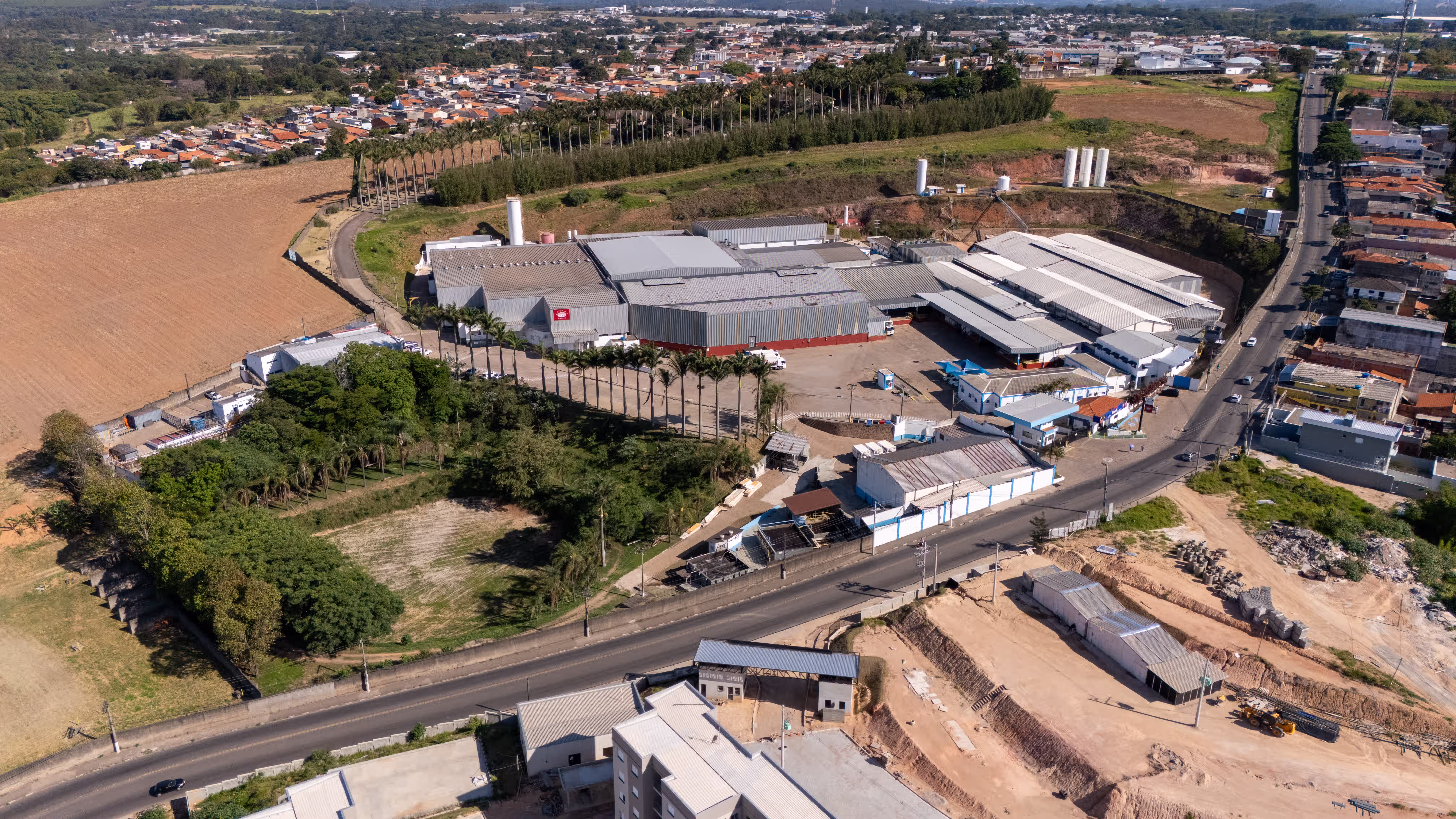 AGRANA Fruit plant in Brazil seen from above, with access road and neighbouring town [no AI]
