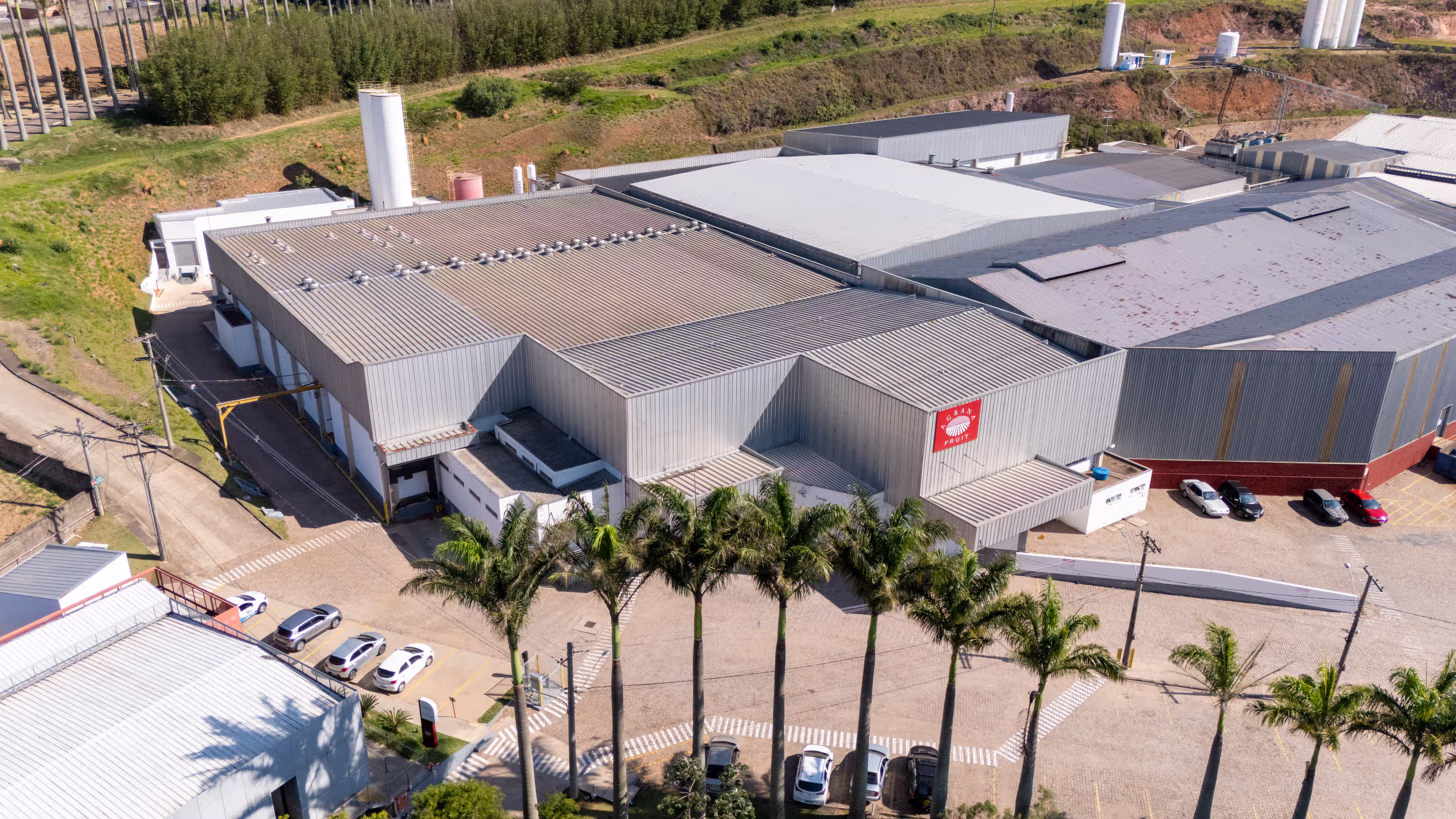 Roofs and forecourt of the AGRANA Fruit plant in Brazil seen from above [no AI]