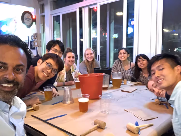People gathered around a table for the Fall Crabfest 2019