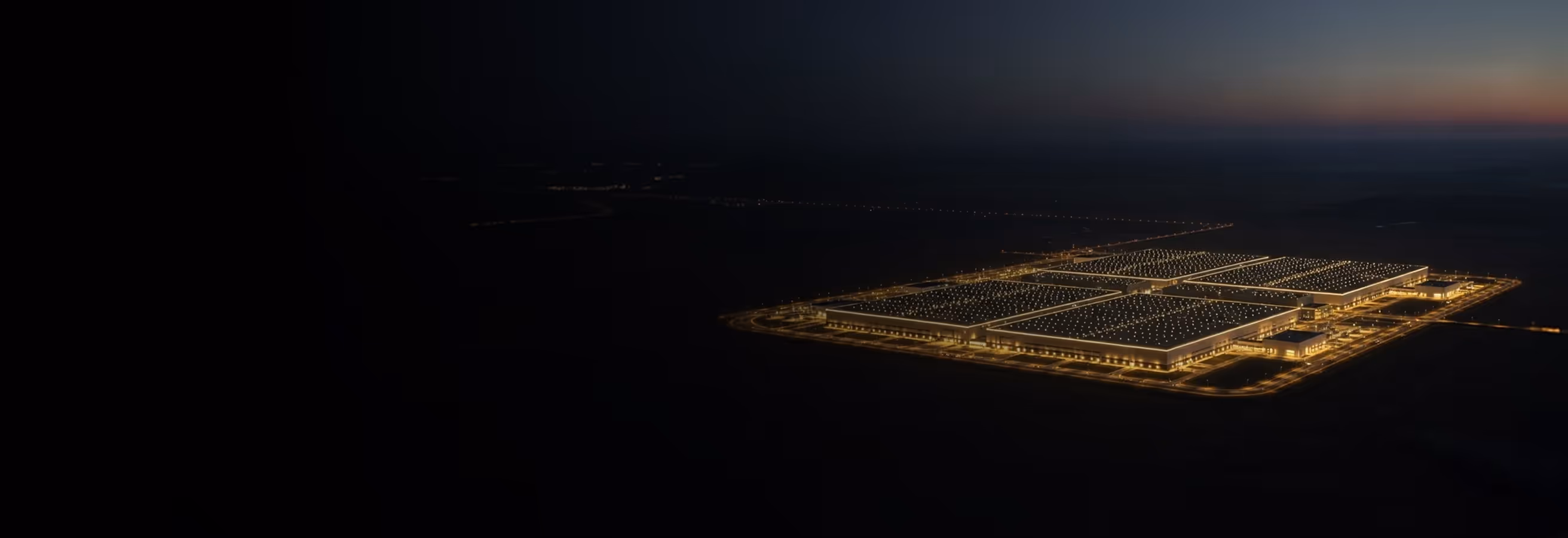 An aerial view of an airport at night.