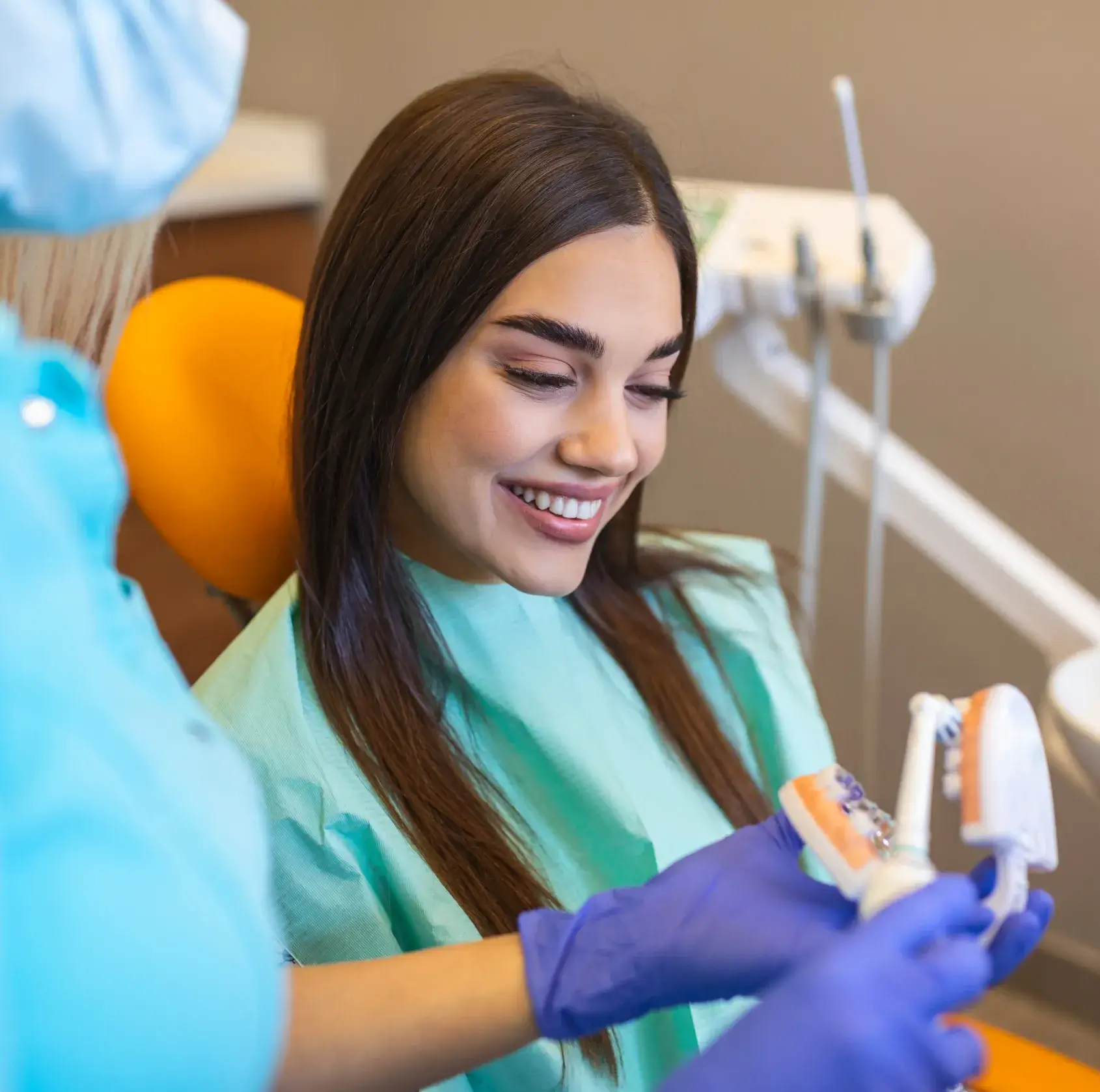 Dentist explainin cleaning to patient